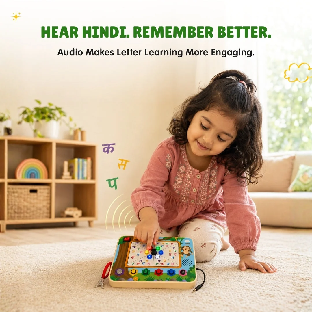 A girl listening to the board speak Hindi letters